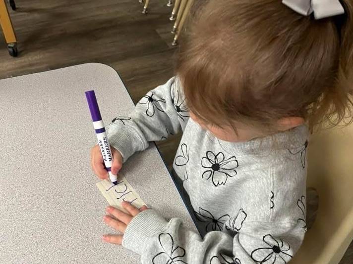 girl practicing writing