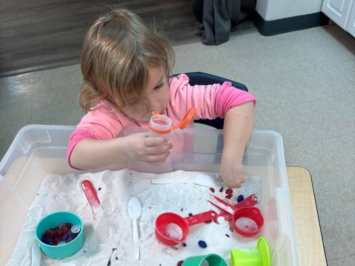 girl playing with toys